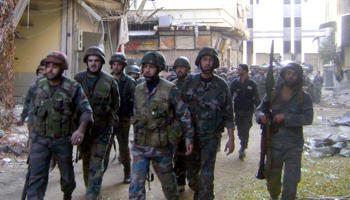 Soldiers loyal to Syria's President Bashar al-Assad in Homs (Reuters/SANA/Handout via Reuters)