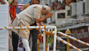 Narendra Modi greets his supporters after addressing a public meeting in Vadodara (Reuters/Amit Dave)