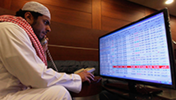 A trader monitors stocks at the Saudi stock market in Riyadh (Reuters/Faisal Al Nasser)