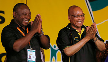 President Jacob Zuma celebrates his re-election alongside Deputy President Cyril Ramaphosa (Reuters/Mike Hutchings)