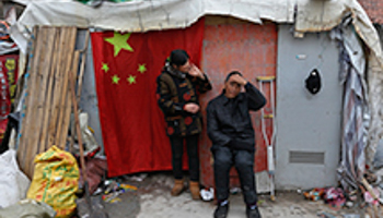 An injured migrant worker and his wife Zhejiang province (Reuters/Stringer)