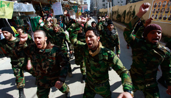 Shi'ite fighters chant anti-Syrian insurgent slogans (Reuters/Alaa Al-Marjani)