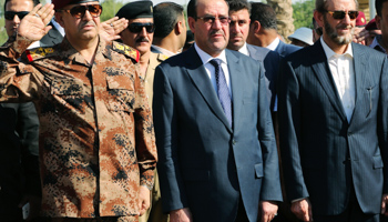 Iraq's Prime Minister Nuri al-Maliki attends the army's sixth division Major General Negm Abdullah Ali's funeral (Reuters/Stringer)