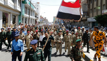 Army and police officers loyal to the al-Huthi group march during a demonstration in Yemen's capital Sanaa (Reuters/Khaled Abdullah)