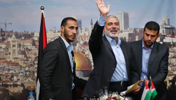 Senior Hamas leader Ismail Haniyeh waves as he leaves his office as a former Hamas government Prime Minister (Reuters/Suhaib Salem)