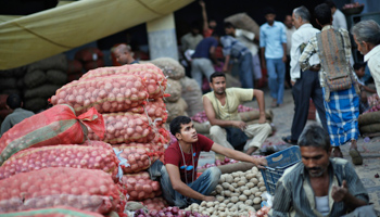 Vendors wait for customers at a wholesale vegetable market in the old quarters of Delhi (Reuters/Anindito Mukherjee)