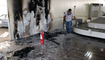 The inside of a damaged terminal is seen after a shelling at Tripoli International Airport (Reuters/Hani Amara)