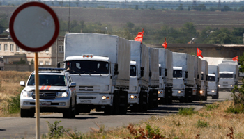 A Russian convoy of trucks carrying humanitarian aid for Ukraine drives on the border with Ukraine (Reuters/Alexander Demianchuk)