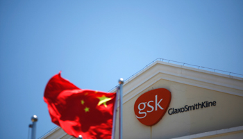 A Chinese national flag in front of a GlaxoSmithKline office building in Shanghai (Reuters/Aly Song)