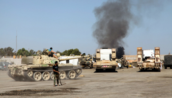 Smoke is seen rising from the Qaaqaa brigade headquarters in Tripoli (Reuters/Stringer)