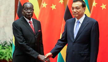 Zimbabwe's President Robert Mugabe and China's Premier Li Keqiang shake hands during their meeting at the Great Hall of the People in Beijing (Reuters/Diego Azubel/Pool)