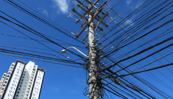 Cables are seen around a utility pole in Salvador (Reuters/Yves Herman)