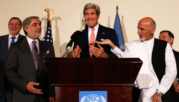 US Secretary of State John Kerry, Afghan presidential candidates Ashraf Ghani Ahmadzai and Abdullah Abdullah talk to each other during a news conference in Kabul (Reuters/Mohammad Ismail)