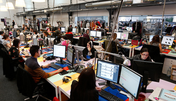 Employees work in front of their computers at the Vente-Privee.com company's headquarters in Saint-Denis near Paris(Reuters/Charles Platiau)