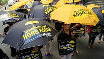 Activists protest in front of the Chinese Consular office in Makati city (Reuters/Romeo Ranoco)