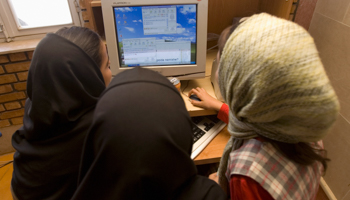 Iranian schoolgirls chat online at an internet cafe which is exclusively for females (Reuters/Stringer)