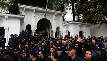 Police officers gather near the Presidential Palace in Algiers (Reuters/Louafi Larbi)