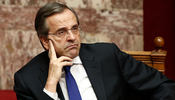 Prime Minister Samaras attends a parliament session before a confidence vote for the country's coalition government in Athens (Reuters/Yorgos Karahalis)