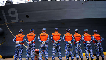 Chinese navy soldiers stand in front of U.S. Seventh Fleet Flagship USS Blue Ridge (Reuters/China Daily)