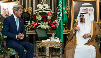 King Abdullah bin Abdul Aziz al-Saud talks with John Kerry before a meeting at the Royal Palace in Jeddah (Reuters/Brendan Smialowski/Pool)