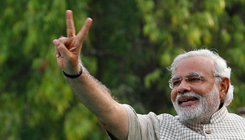 Modi gestures during a public meeting in Vadodra (Reuters/Amit Dave)