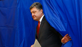 Poroshenko walks out of a voting booth during a parliamentary election in Kiev (Reuters/Shamil Zhumatov)