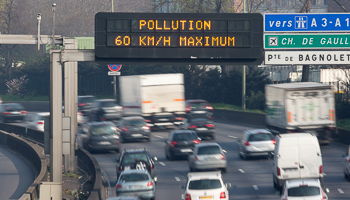 A road sign reads "Pollution, speed limit 60kms" on the Paris ring road (Reuters/Charles Platiau)