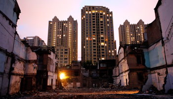 Houses under demolition a seem at Xintiandi area, one of the most expensive per square meter of Shanghai (Reuters/Carlos Barria)