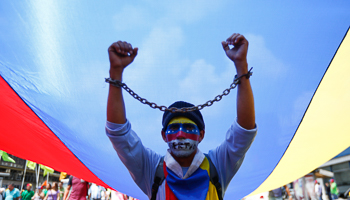 Opposition supporters take part in a march against the government in Caracas (Reuters/Jorge Silva)