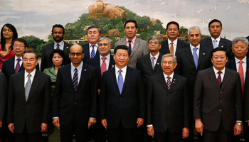 Xi Jinping poses for photos with guests at the AIIB launch ceremony at the Great Hall of the People in Beijing (Reuters/Takaki Yajima/Pool)