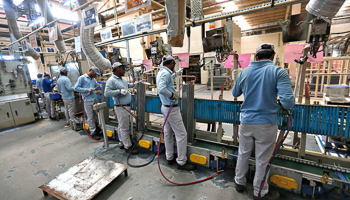 Workers assemble air conditioners inside the Daikin Industries Ltd. plant at Neemrana in the desert Indian state of Rajasthan (Reuters/Adnan Abidi)