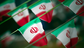 Iran's national flags are seen on a square in Tehran (Reuters/Morteza Nikoubazl)