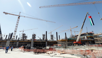 Labourers work at the construction site of Abu Dhabi's airport terminal (Reuters/Ben Job)