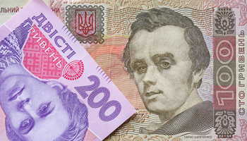 Ukrainian hryvnia banknotes are seen in a photo illustration shot in Kiev (Reuters/Konstantin Chernichkin)