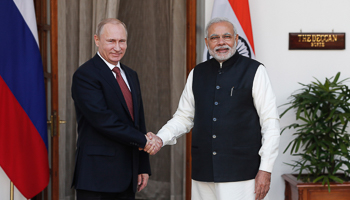 Putin shakes hands with Modi ahead of their meeting at Hyderabad House in New Delhi (Reuters/Adnan Abidi)