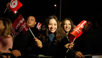 Supporters of the Nidaa Tounes secular party movement wave flags and shout slogans outside Nidaa Tounes in Tunis (Reuters/Zoubeir Souissi)