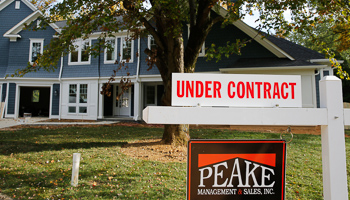 A real estate sign advertising a home "Under Contract" is pictured in Vienna, Virginia (Reuters/Larry Downing)