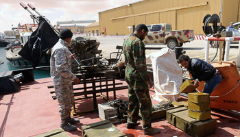 Supporters of Ibrahim Jathran unload ammunition from a boat at Es Sider port in Ras Lanuf (Reuters/Esam Omran Al-Fetori)