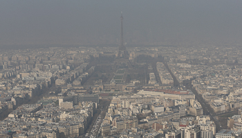 A general view shows the Eiffel tower and the Paris skyline through a small-particle haze (Reuters/Philippe Wojazer)
