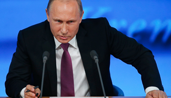 Putin speaks during his annual end-of-year news conference in Moscow (Reuters/Maxim Zmeyev)