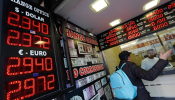 A man checks currency exchange rates at an currency exchange office in Istanbul (Reuters/Murad Sezer)