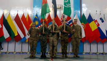 Afghan and NATO-led International Security Assistance Force soldiers stand at attention during the change of mission ceremony in Kabul (Reuters/Omar Sobhani)