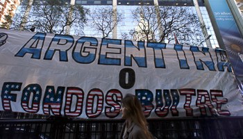 A banner reads "Argentina or vulture funds" during a demonstration outside the Argentine Congress in Buenos Aires (Reuters/Marcos Brindicci)