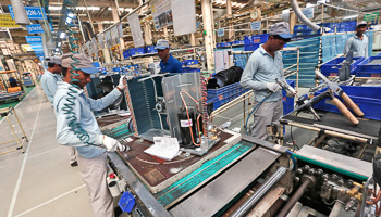 Workers assemble air conditioners inside the Daikin Industries Ltd. plant at Neemrana, Rajasthan (Reuters/Adnan Abidi)