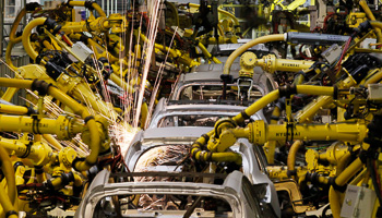 Machines weld cars in a factory in Zilina (Reuters/Petr Josek)