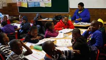 Children attend class at a school in Phokeng (Reuters/Mike Hutchings)