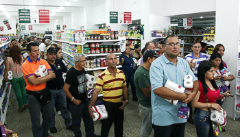 People queue to buy basic goods in San Cristobal (Reuters/Carlos Eduardo Ramirez)