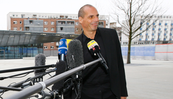 Greek Finance Minister Yanis Varoufakis smiles as he speaks to media outside the European Central Bank (Reuters/Kai Pfaffenbach)