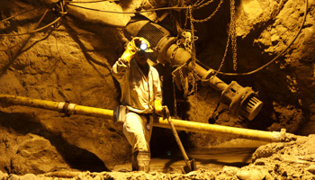 A mine worker is seen underground in South Deep mine outside Johannesburg (Reuters/Siphiwe Sibeko)