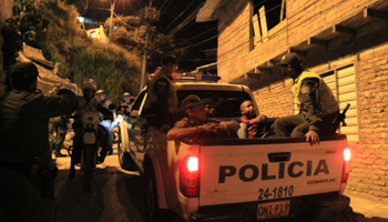 Police arrest three men during a raid in Cali (Reuters/Jaime Saldarriaga)